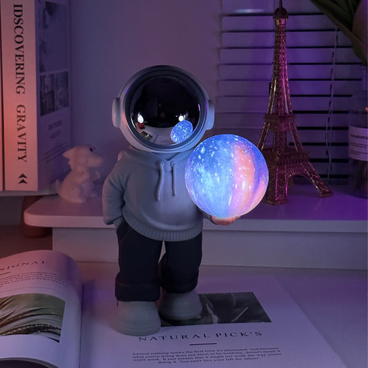 Creative Astronaut Bluetooth Speaker with 3D Starry Sky Lighting (grey top + navy blue pants)