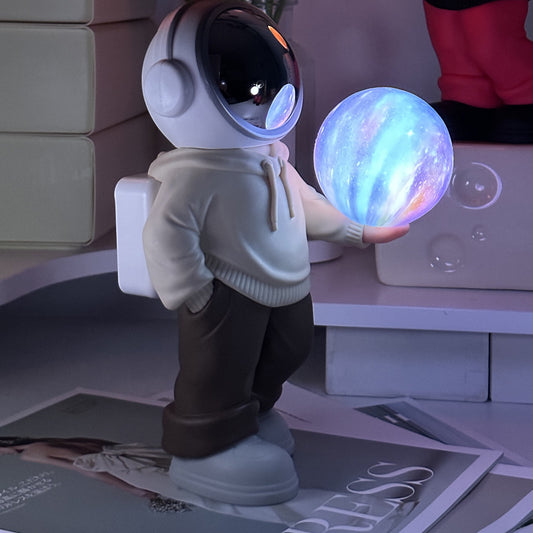 Creative Astronaut Bluetooth Speaker with 3D Starry Sky Lighting (beige top + brown pants)