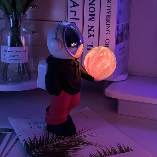 Creative Astronaut Bluetooth Speaker with 3D Starry Sky Lighting (black top + red pants)